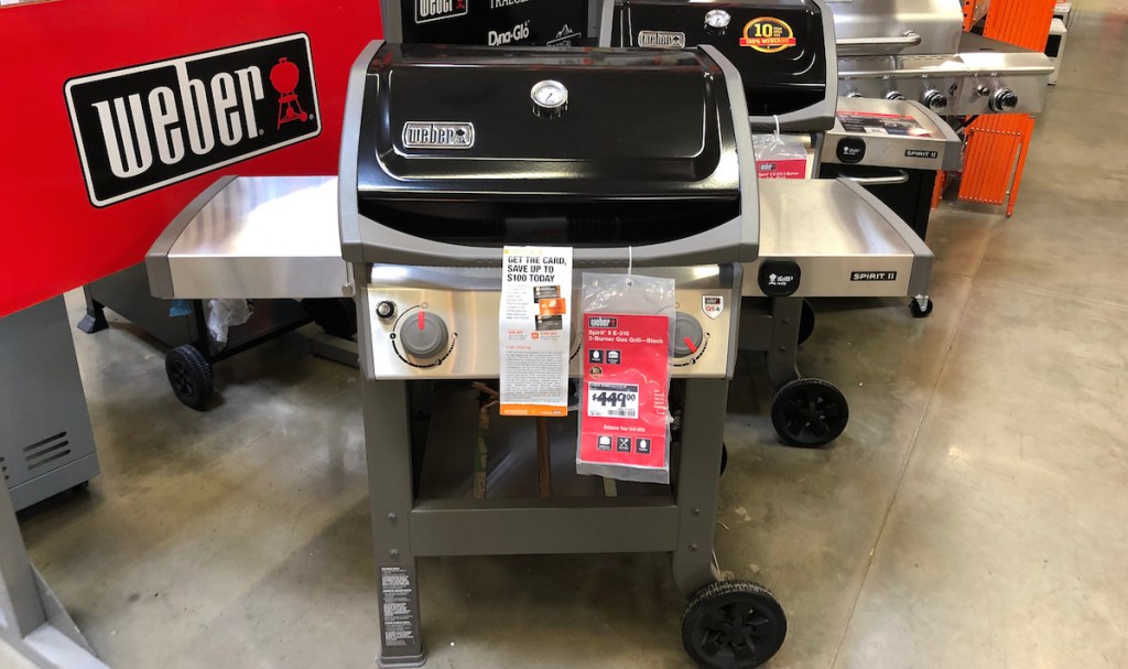 black and stainless steel weber grill in store