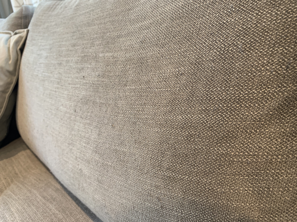 close up of grey couch cushion 