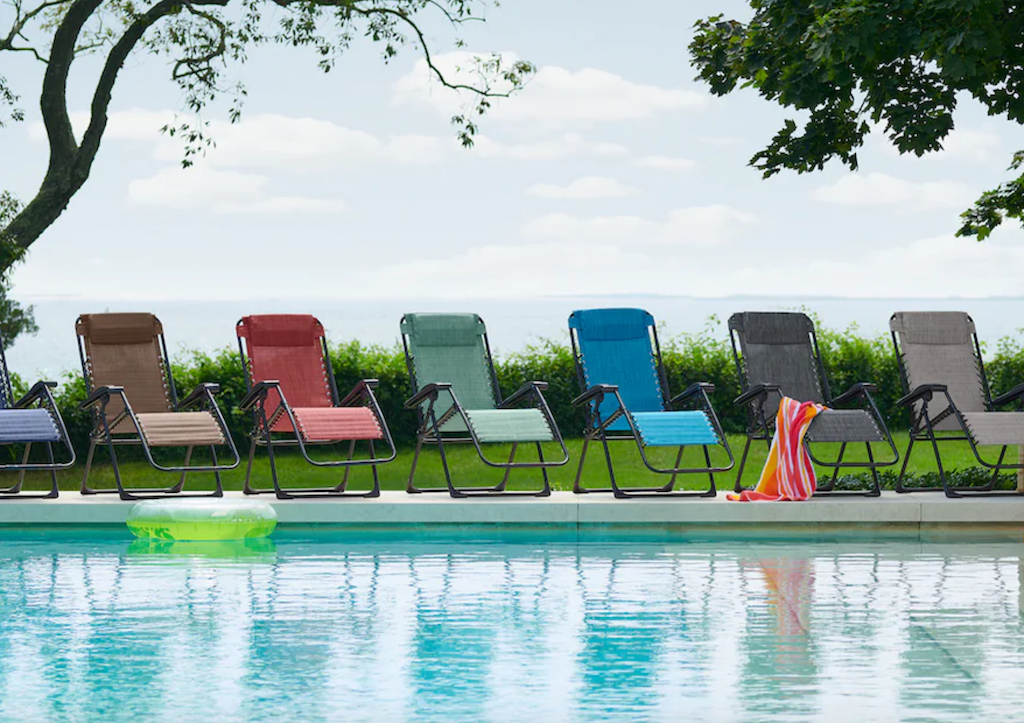 anti-gravity chairs lined up by pool 