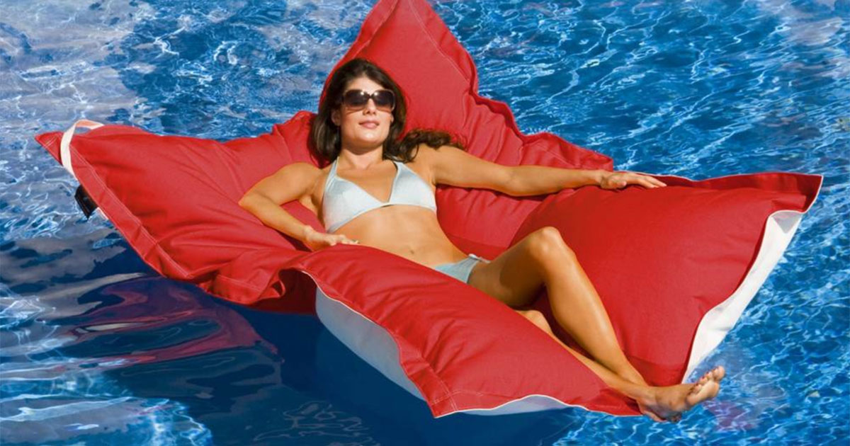 lady laying on large bean bag pool float 