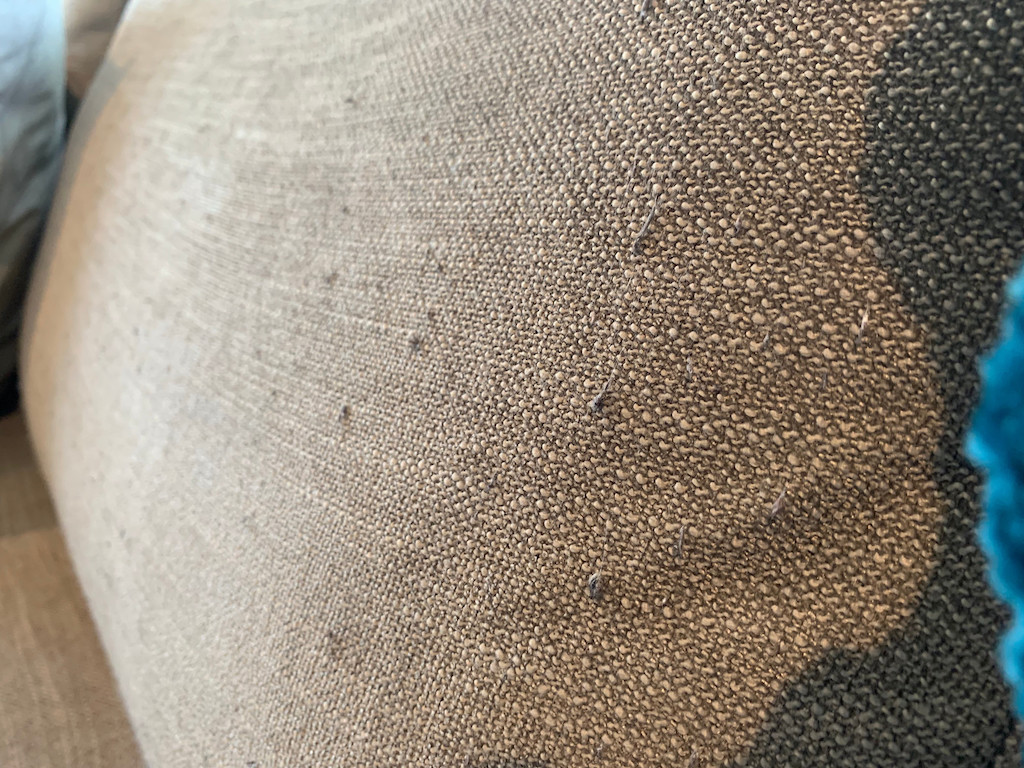 close up of pilling on couch cushion 
