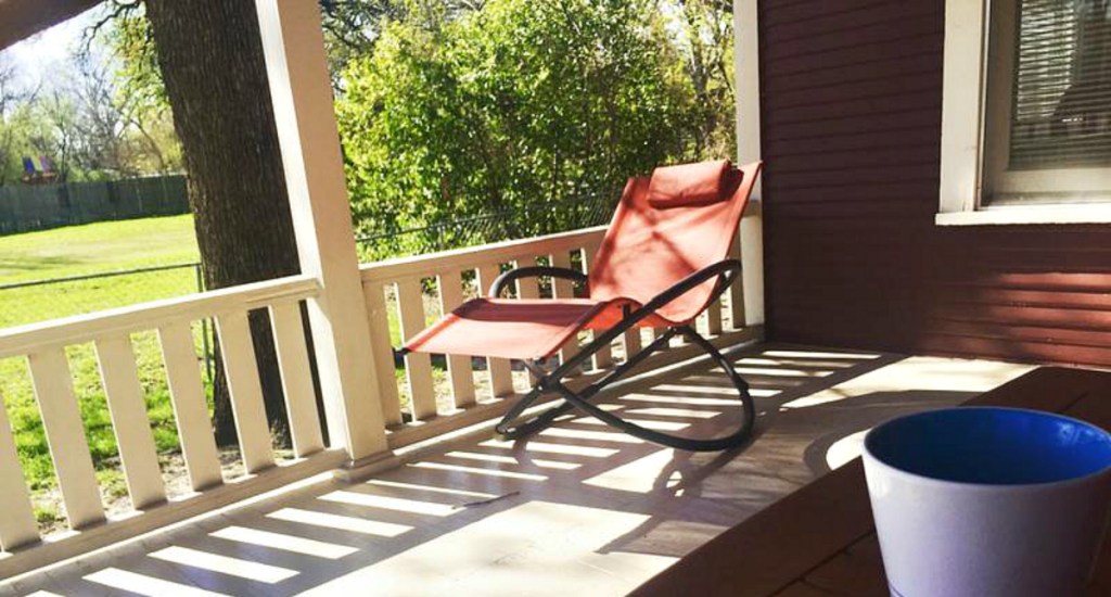 orange orbital chair on front porch 