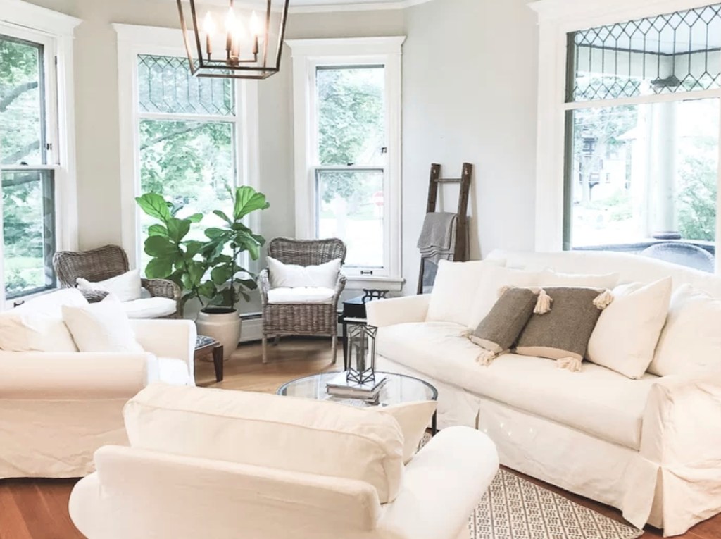 white living room with slipcovered furniture