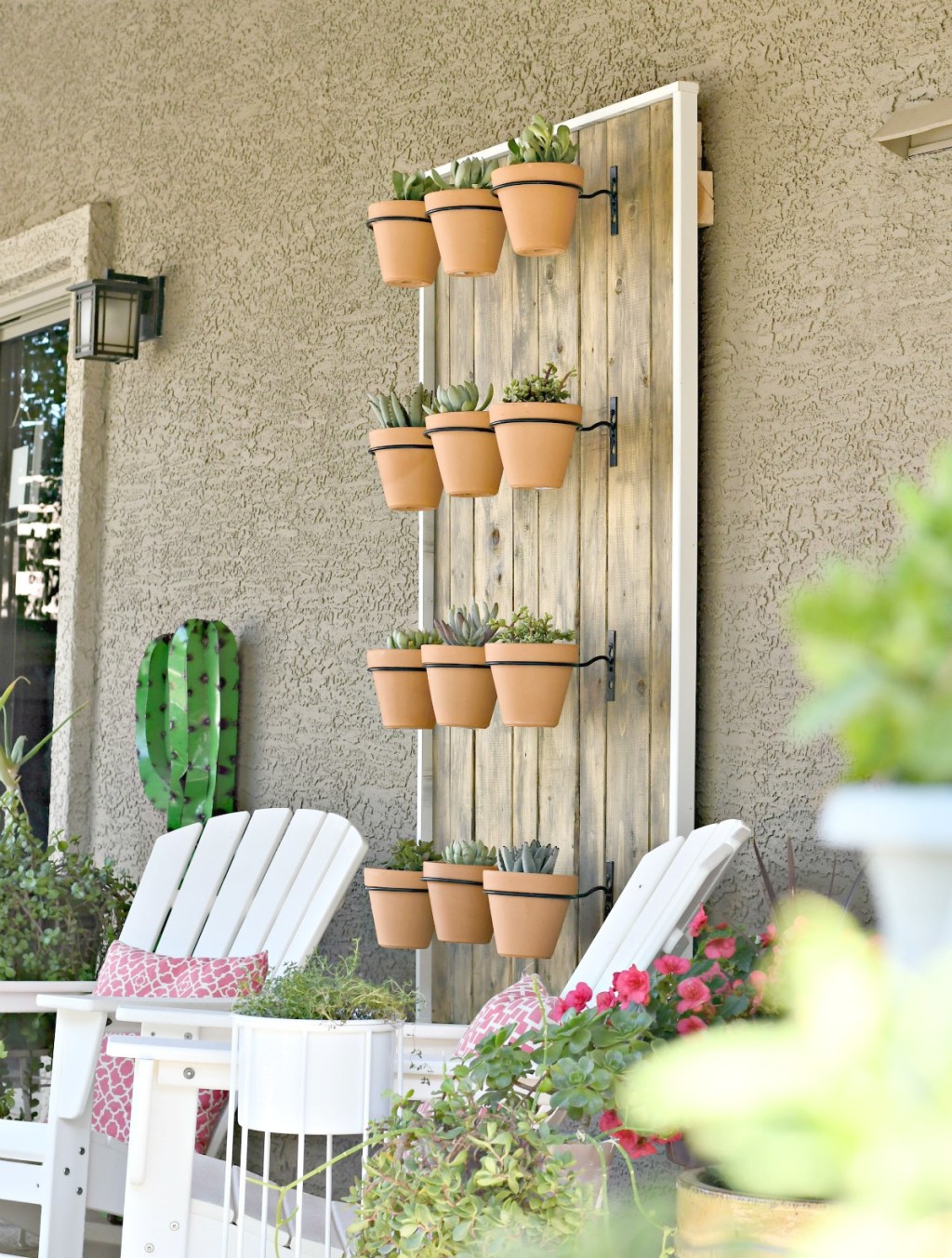 hanging display of potted succulents on the way
