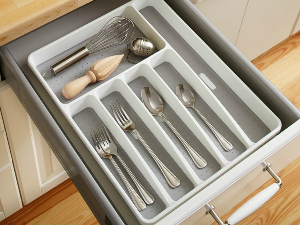 silverware in a silverware organizer in a drawer in the kitchen