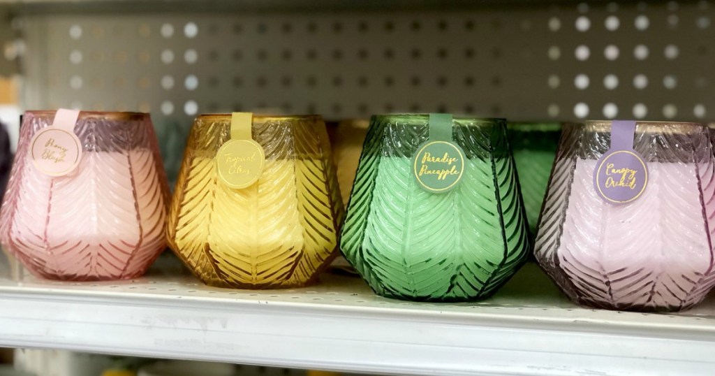several colored candles on a store shelf