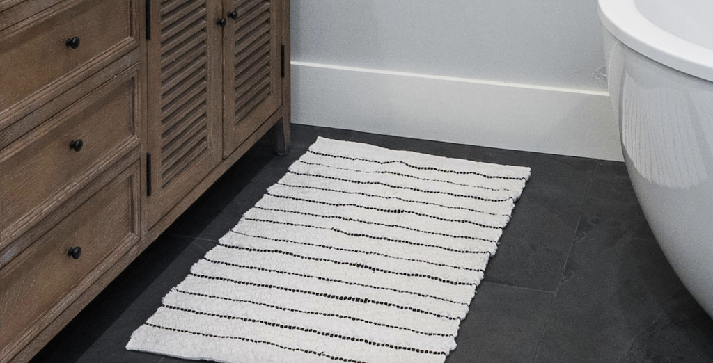 striped rug on bathroom floor 