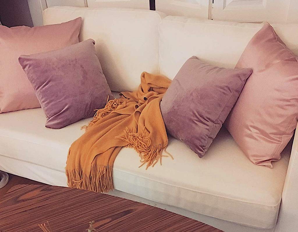 velvet pillows on cream color couch
