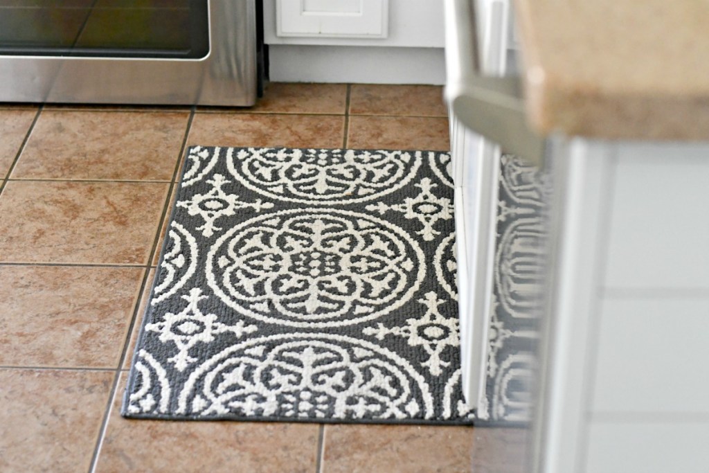 threshold grey medallion washable rug on the kitchen floor 