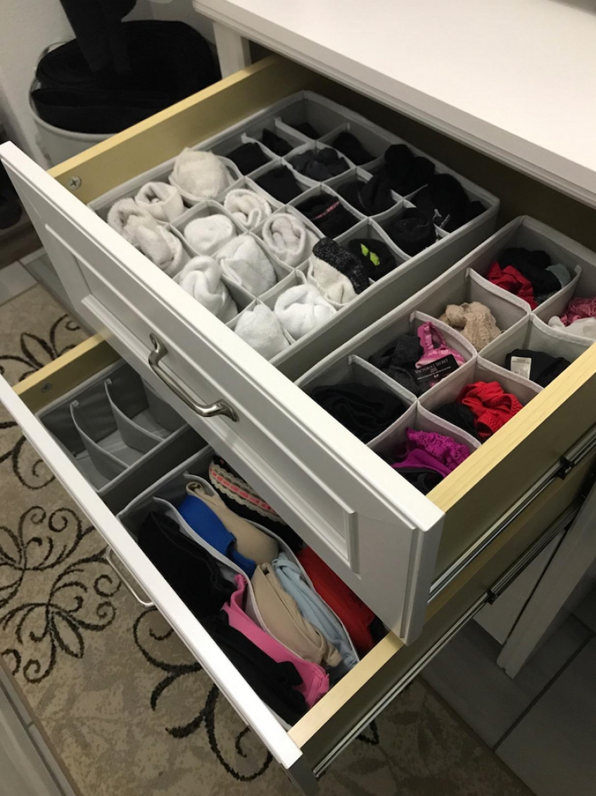 drawers open with organization bins inside filled with socks, underwear and bras