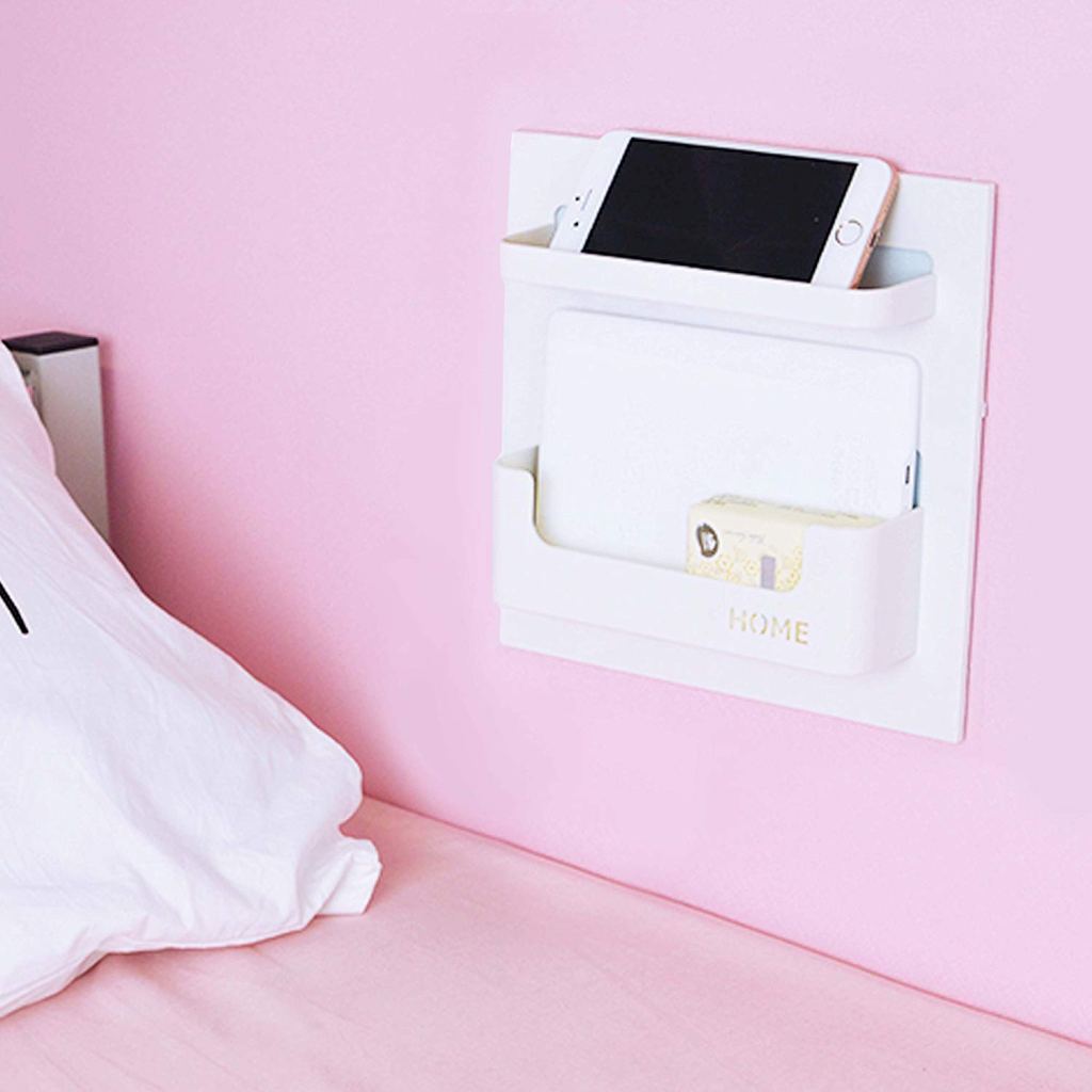 bedside shelf organizer on pink wall