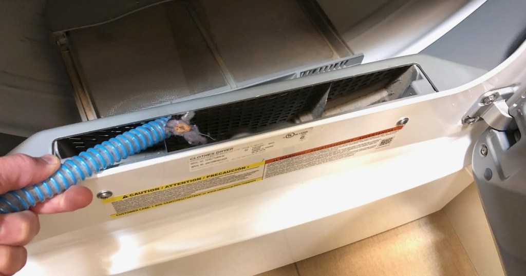 blue hose cleaning lint from inside dryer