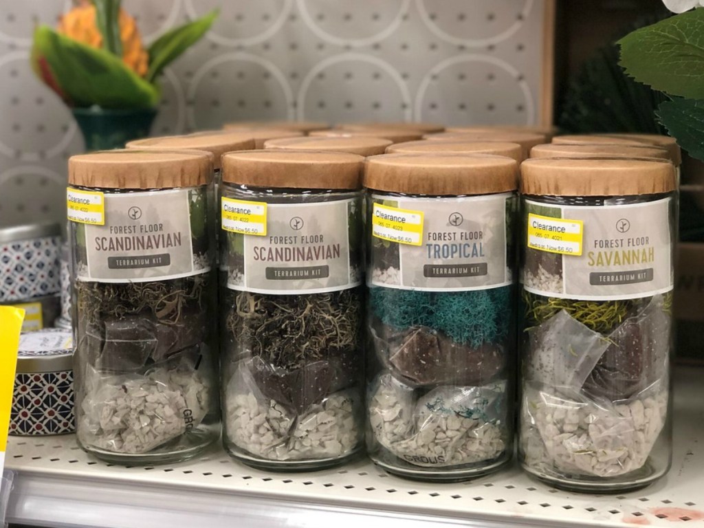 store shelf showing glass bottles with planting supplies