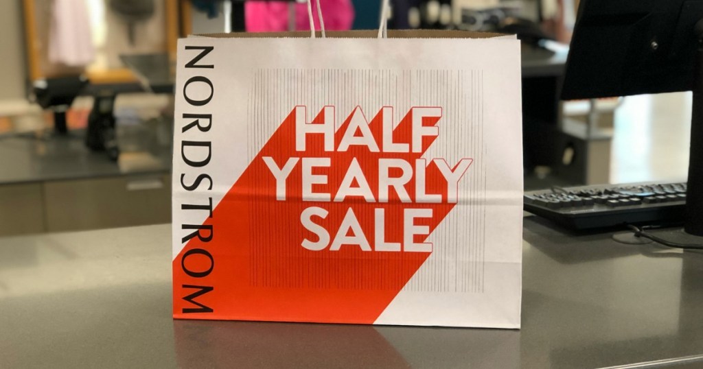Nordstrom half yearly sale bag on counter 