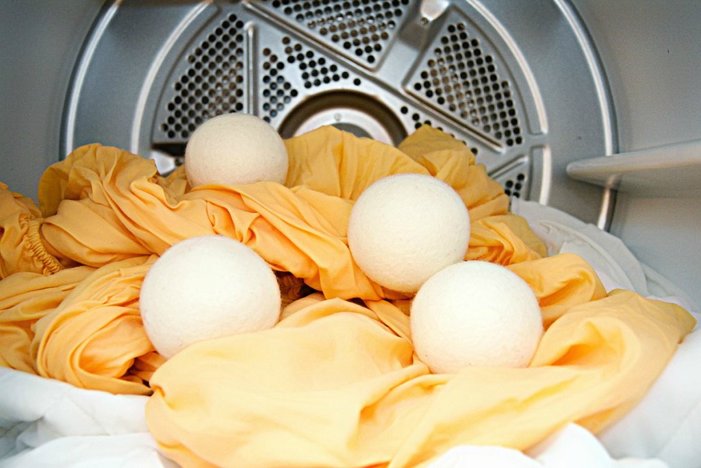 dryer with wool balls and orange sheet