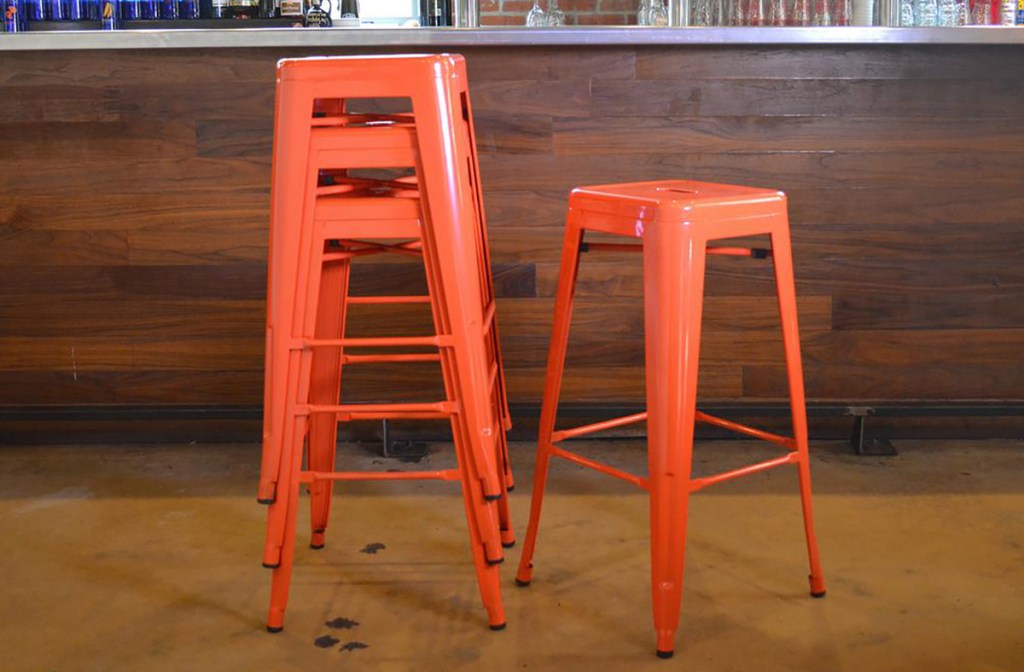 amerihome orange stools at the bar