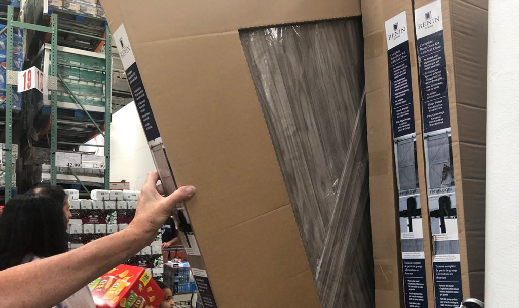pulling out barn door kit at Costco