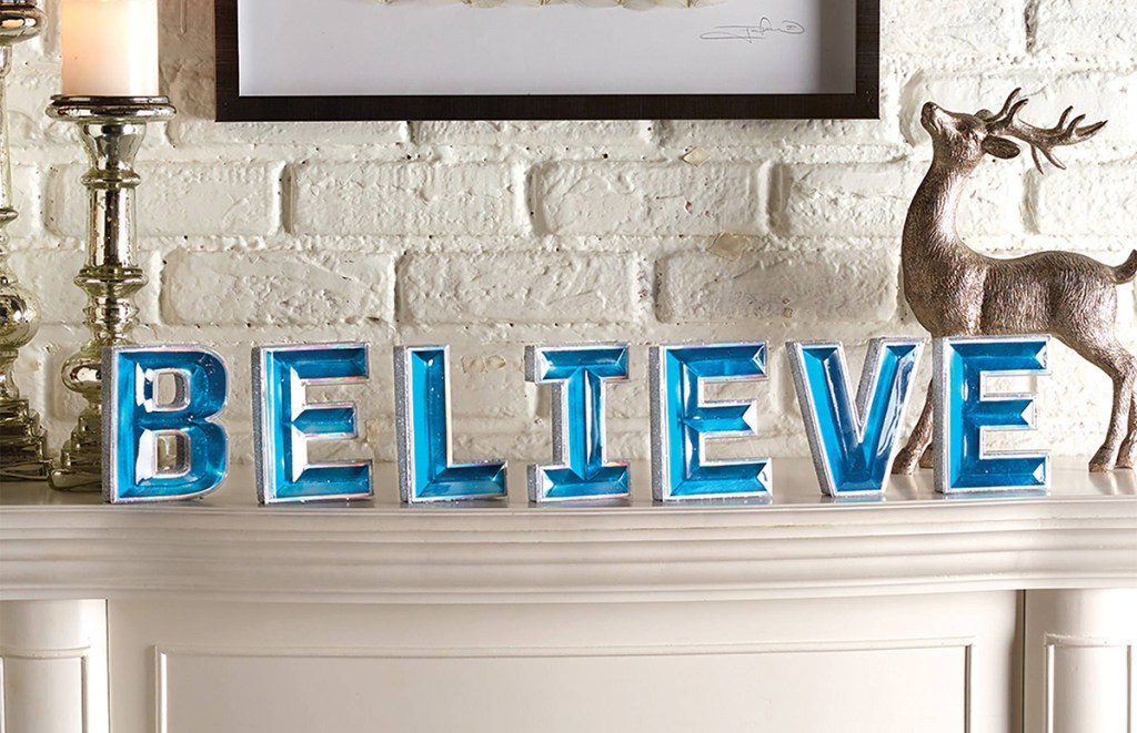 blue gem believe letters on mantle