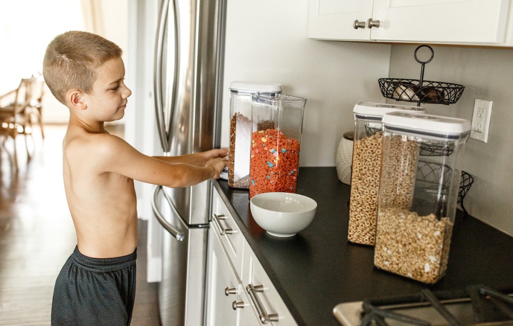 boy with cereal oxo containers
