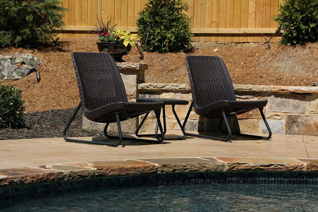 chairs and table by a pool