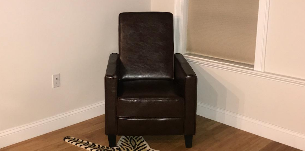 faux leather reclining chair in living room 