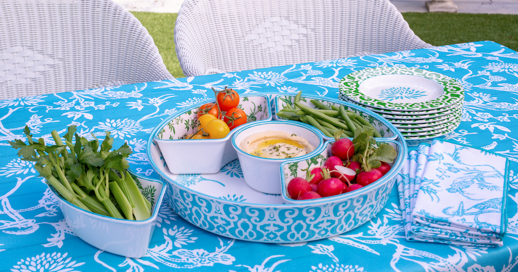blue summer table setting with veggies and dip