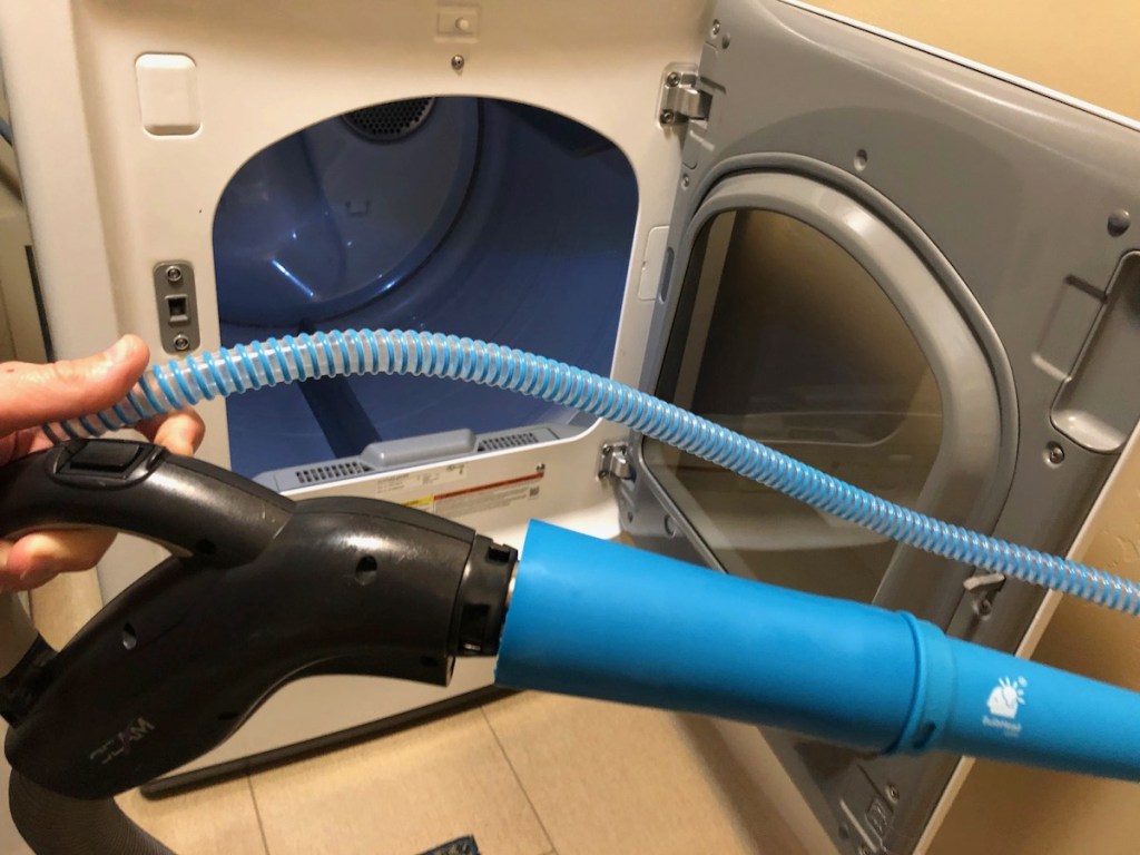 blue attachment on vacuum wand with dryer in background