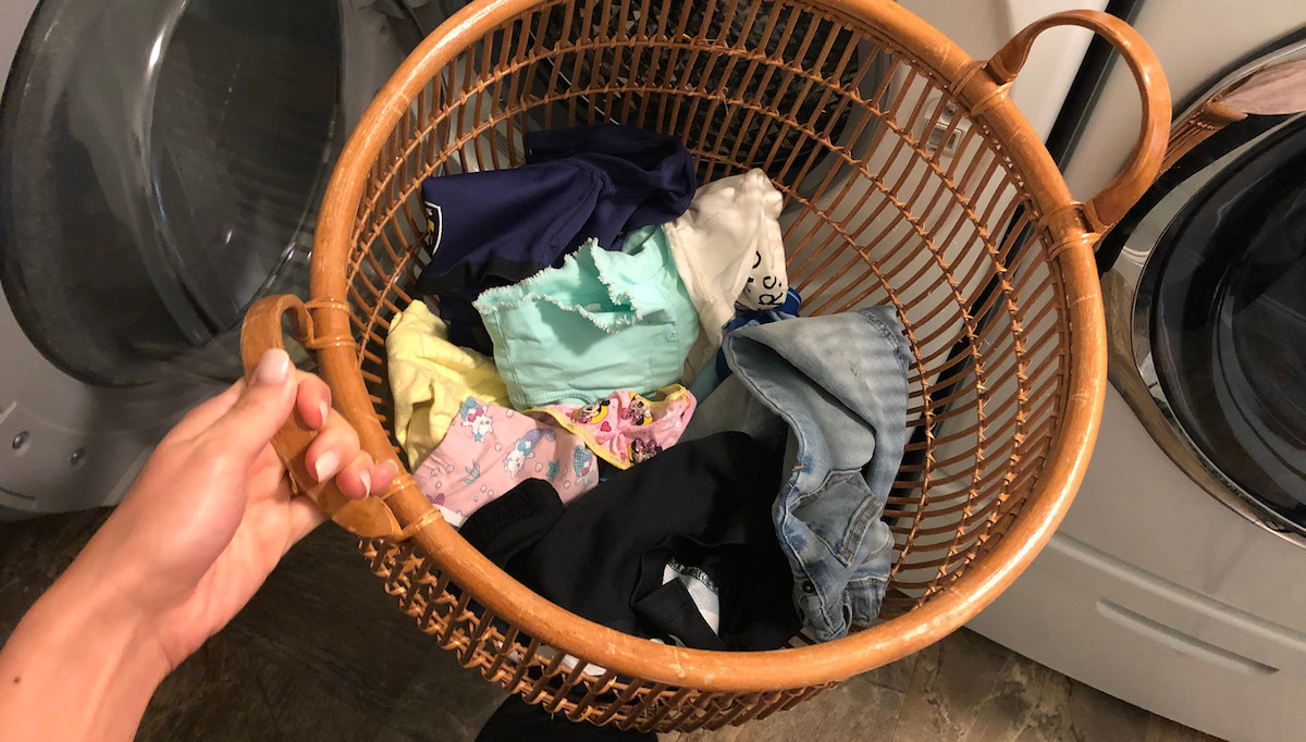 laundry basket with various colors of clothing inside
