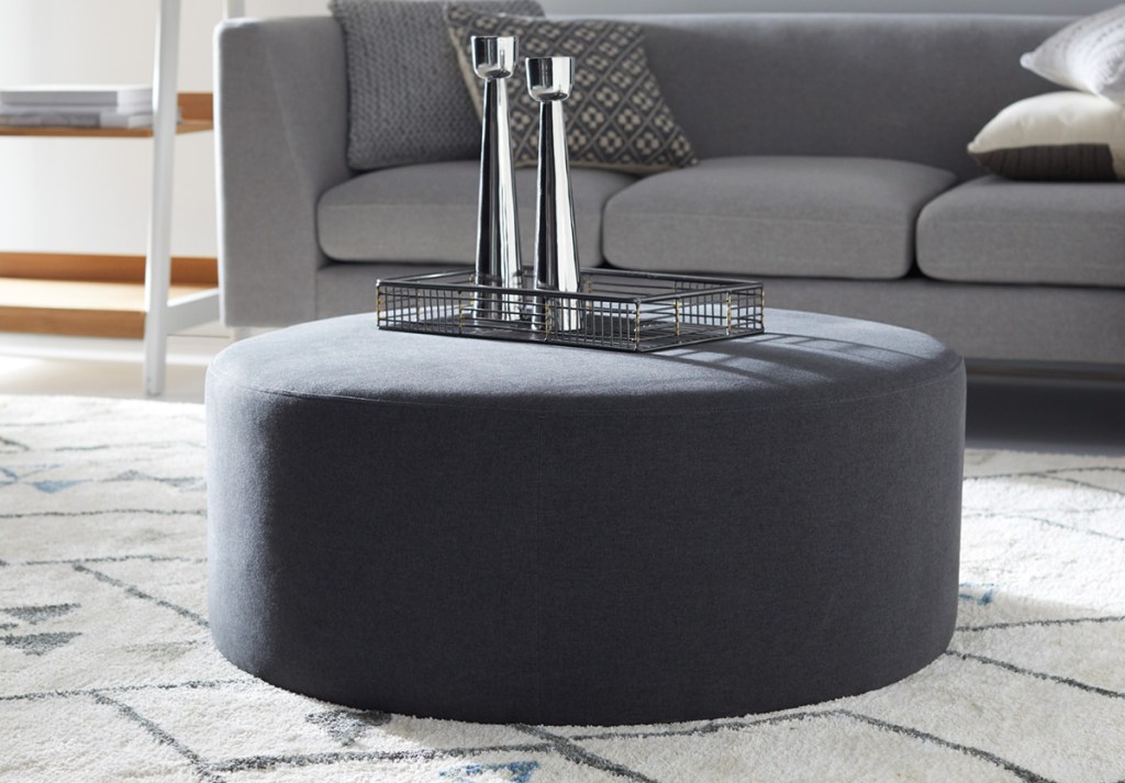 modrn ottoman in living room with couch