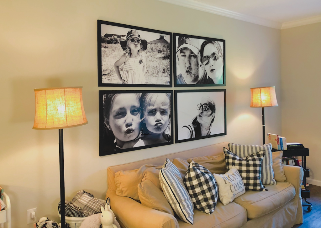 family photo gallery wall above couch in living room