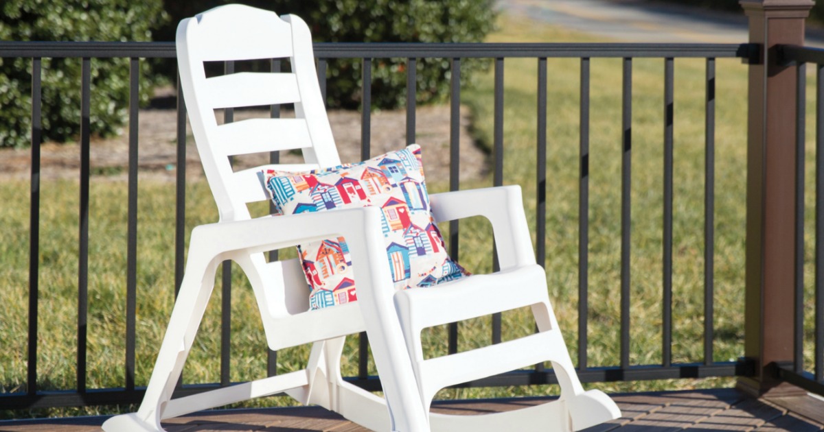 white rocking chair with throw pillow on front porch 