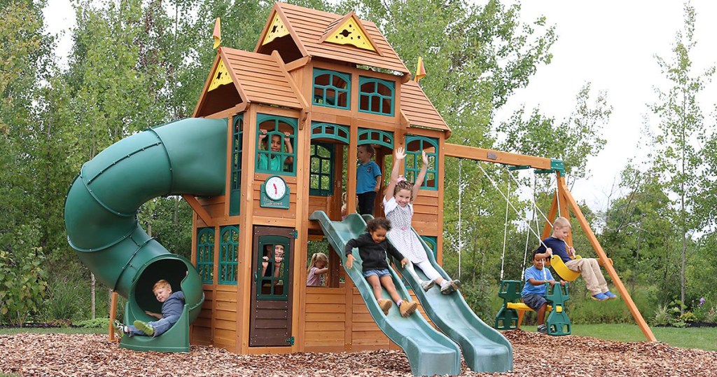 kids playing on falcon ridge playset