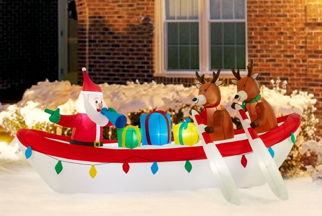 santa and reindeer in a rowboat inflatable lawn decor