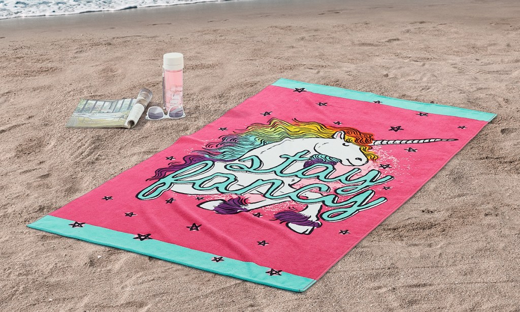 unicorn towel on beach