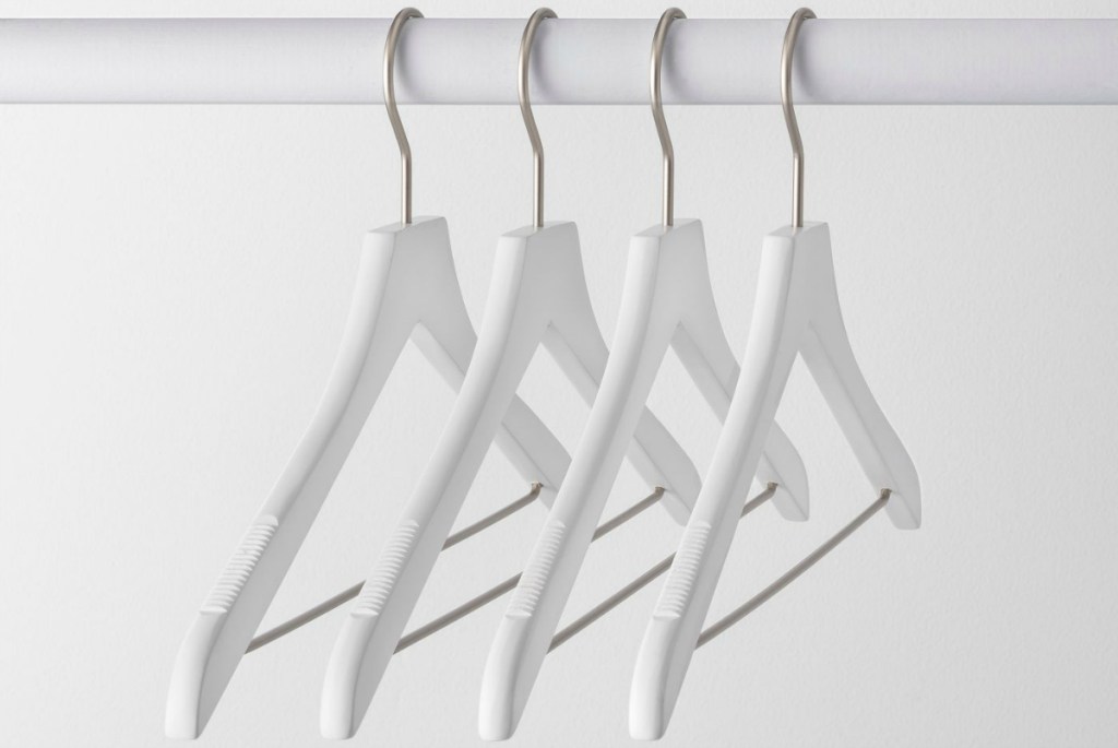 white wooden hangers