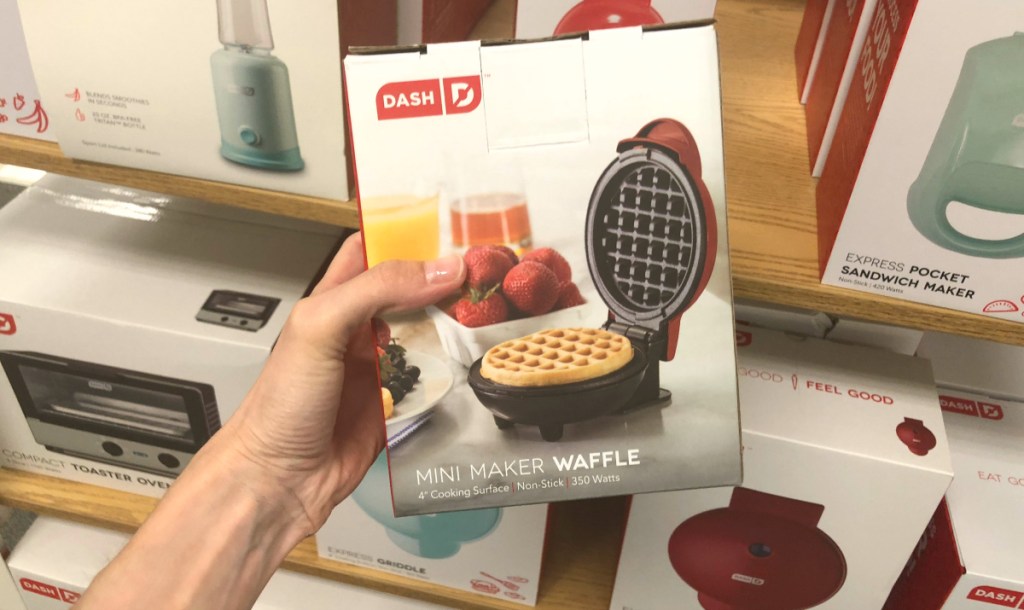 hand holding Dash Mini Waffle Maker box