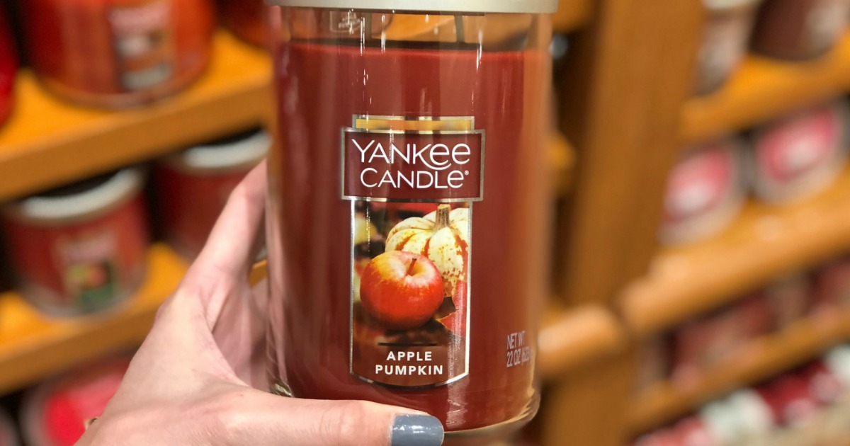 holding Yankee Candle apple pumpkin large tumbler 