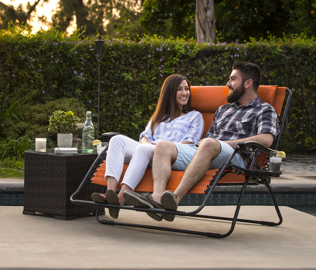 couple sitting on outdoor lounger