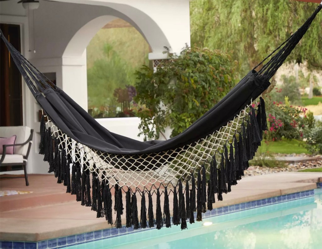 fringe hammock hanging by pool