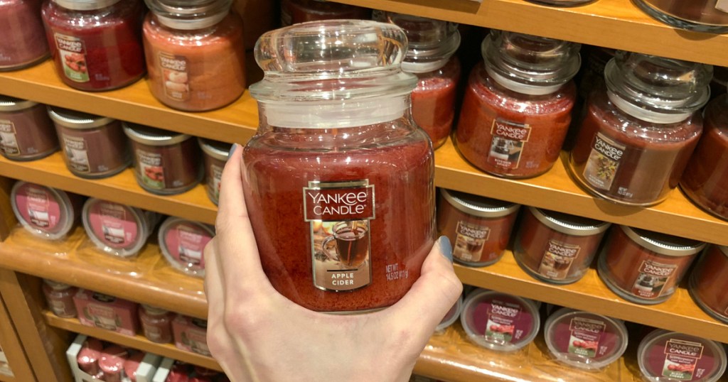 hand holding yankee candle jar