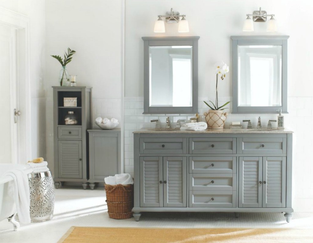 bathroom with gray counter and mirror