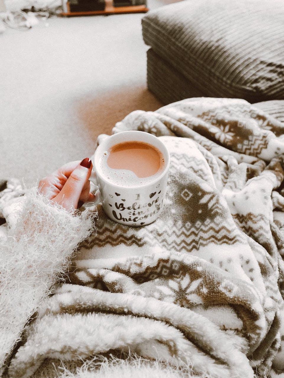 relaxing on couch with coffee and blanket